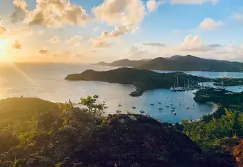 A sunset over a Caribbean island