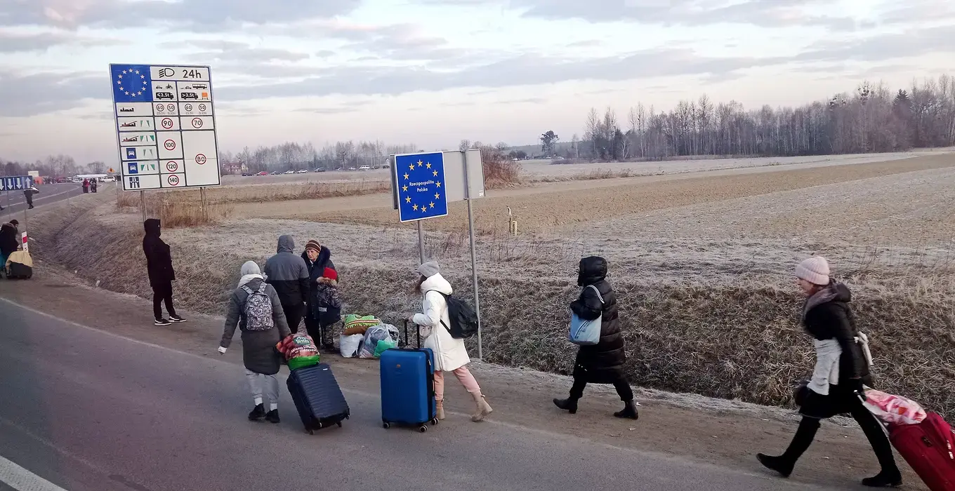 People cross the border from Ukraine into Poland on 27 February 2022