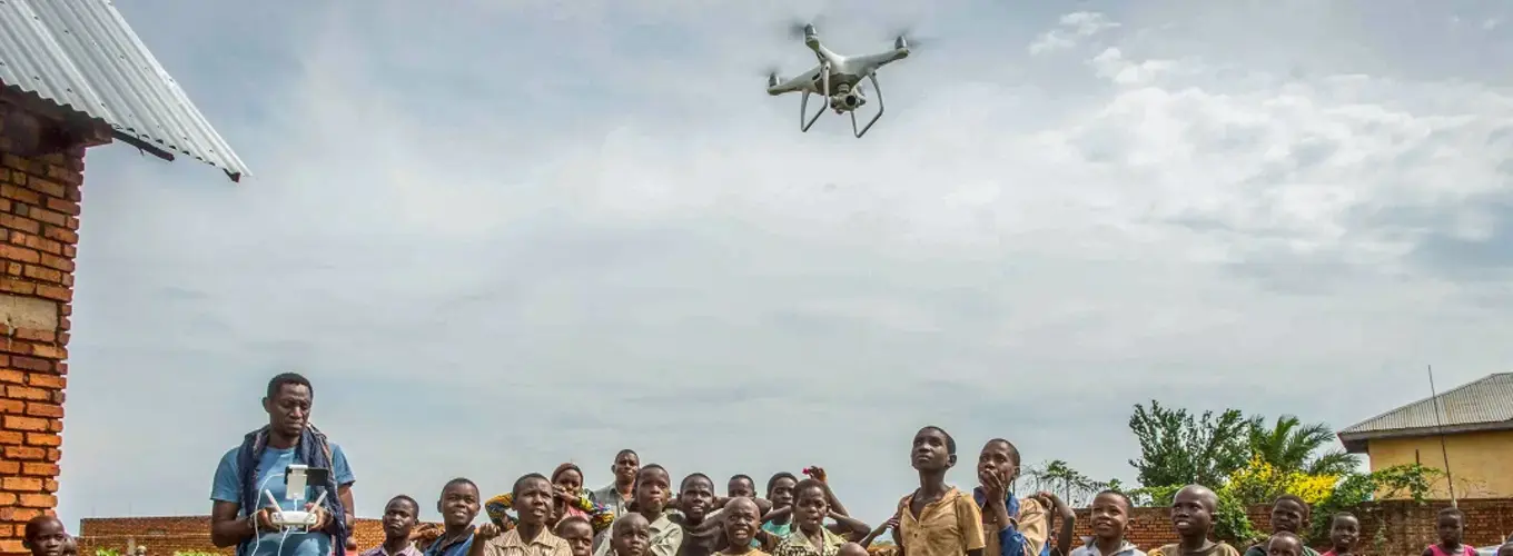 drone flying over a group of people in the Democratic Republic of Congo