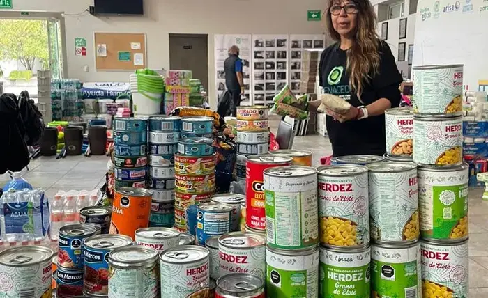A volunteer organizes food items in the aftermath of Hurricane Otis in Guerrero, Mexico