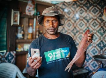 Mele Rara is the UnBlocked Cash vendor in the rural village of Tasiriki where he runs a fish market. He says that the program has generated a lot of interest in his community. He has new customers and has made increased profits which have helped him and his family in the wake of cyclone Harold. ©Arlene Bax/Oxfam in Vanuatu