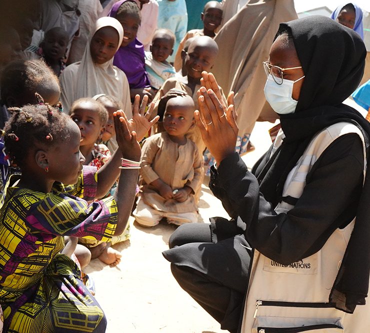 Photograph of a humanitarian worker with children