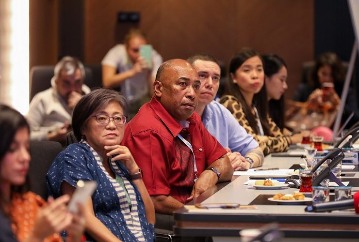 Participants listen attentively to the presentation given by Mr. Osman of AKOM