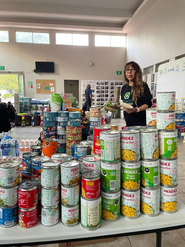 A volunteer organizes food items in the aftermath of Hurricane Otis in Guerrero, Mexico