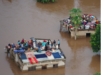 People stranded on top of houses in the aftermath of the floods in Mozambique, January 2026. Photo: Mercy Air