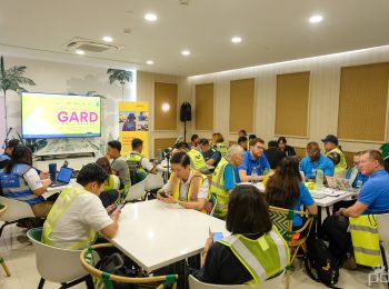 High-visibility vests instead of lanyards: staff from NNIC, DHL, the Manila International Airport Authority, the World Food Programme, and other agencies worked in small groups, table by table, mapping out capacity and constraints before taking the exercise outside onto the airfield itself. Photo credit: PDRF